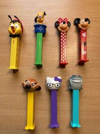 PEZ Spender (7 Stk.): Mickey Mouse, Minnie Mouse, Hello Kitty, Bruce & weitere
