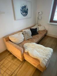 Ecksofa mit Bettfunktion inklusive Fell + Kissen