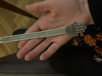 Lesezeichen Hand Metall